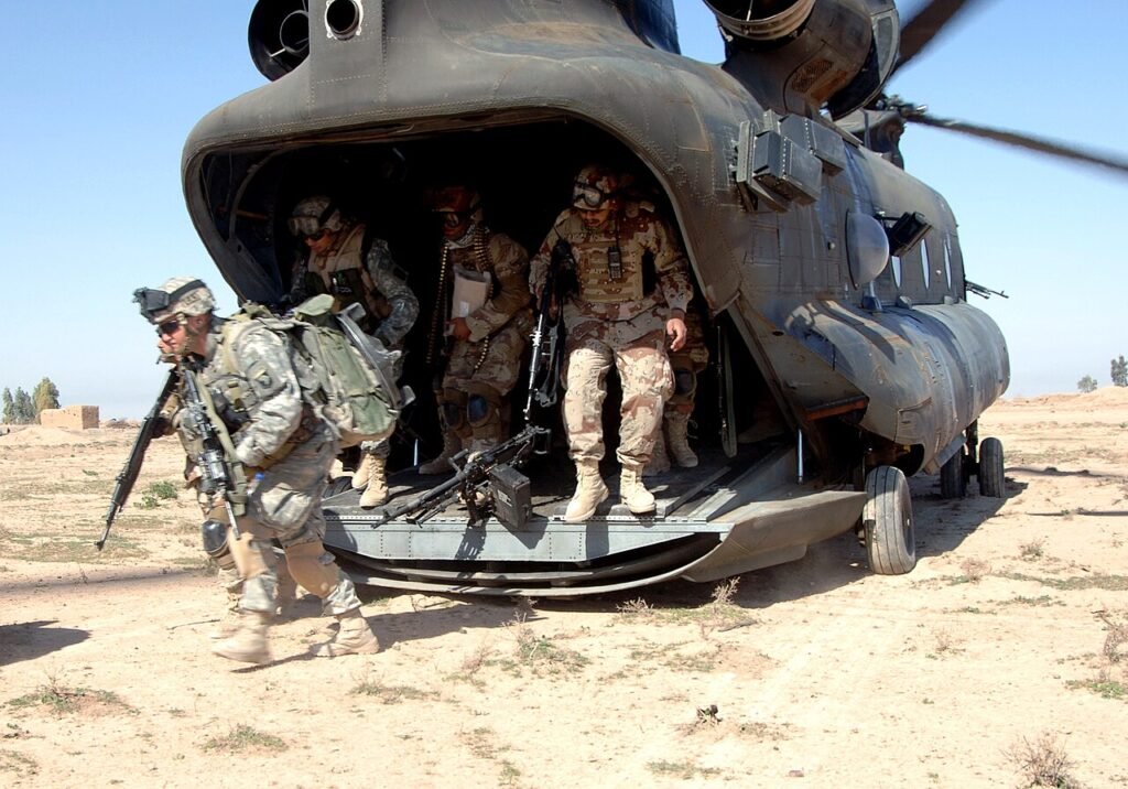 U.S. Army soldiers of the 101st Airborne Division’s Company C, 3rd Battalion, 187th Infantry Regiment, exit an Army CH-47 Chinook helicopter at Brassfield-Mora, Iraq, March 16, 2006, in support of Operation Swarmer. U.S. Navy Photo by Petty Officer 3rd Class Shawn Hussong - U.S. Navy Photo